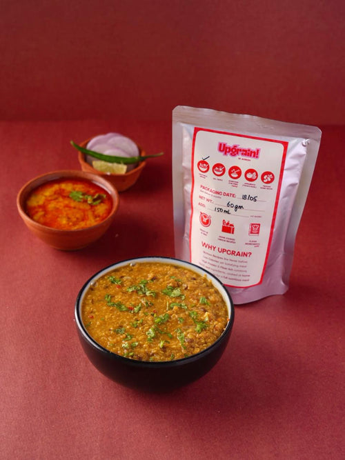 Two bowls of Quinoa with a package labeled 'Upgrain' on a red background